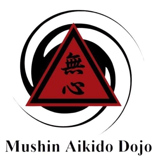 Mushin Aikido Dojo logo, a red triangle with the kanji for mushin inside a black swirling circle