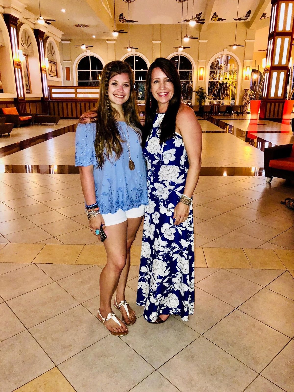 Carmen Holley, right, with a travel companion in a resort lobby