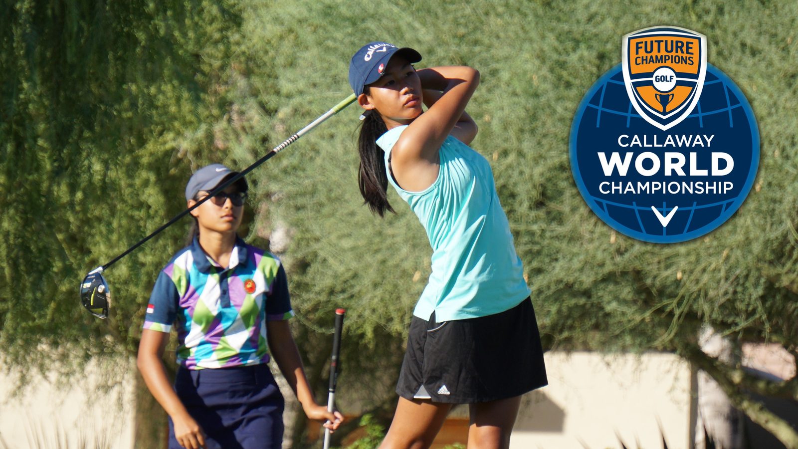 A junior golfer at the top of her swing beside the FCG Callaway World Championship logo