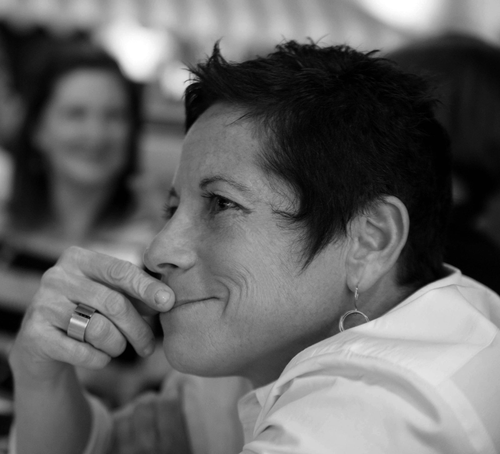 Emily Goldstein, owner of m design in Baltimore, in a black and white profile portrait with her chin resting on her hand