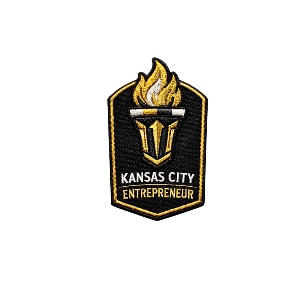 Embroidered black and gold Kansas City Entrepreneur patch with a flaming torch