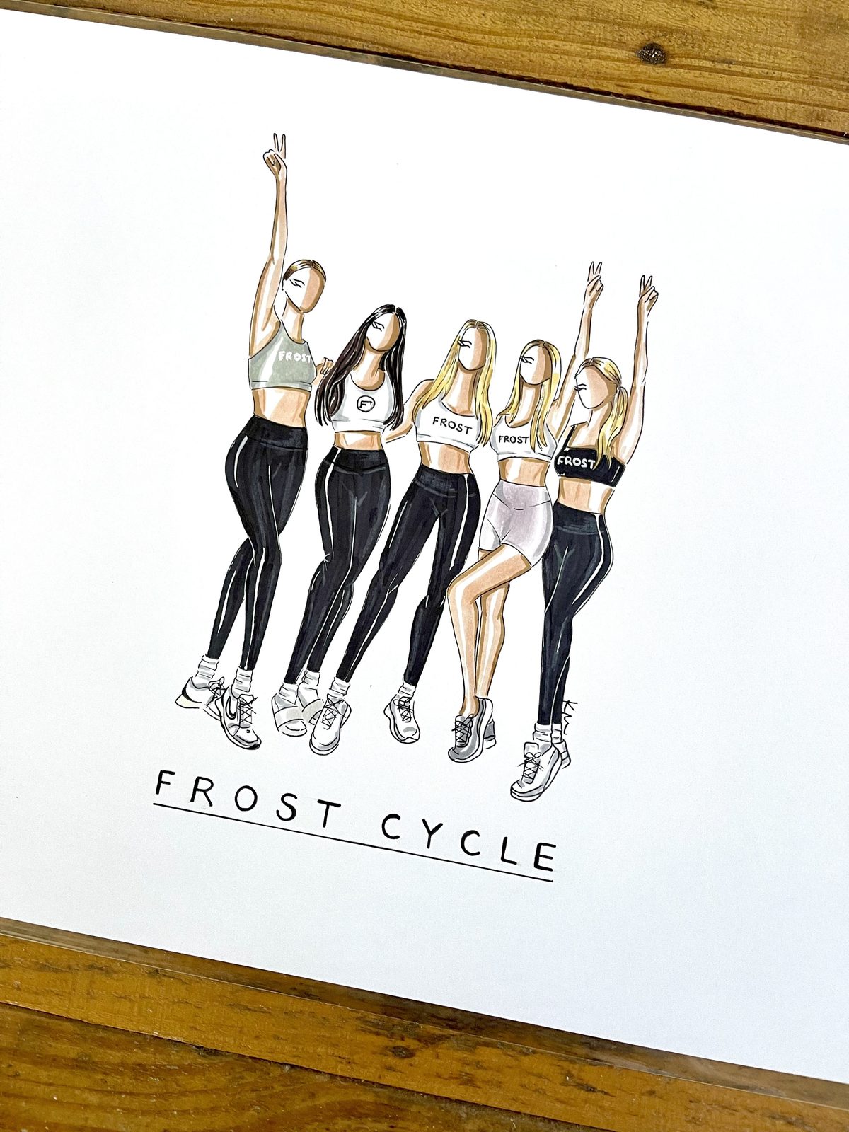 A Sketchbook custom illustration of five women in Frost Cycle workout wear, drawn in marker on white paper