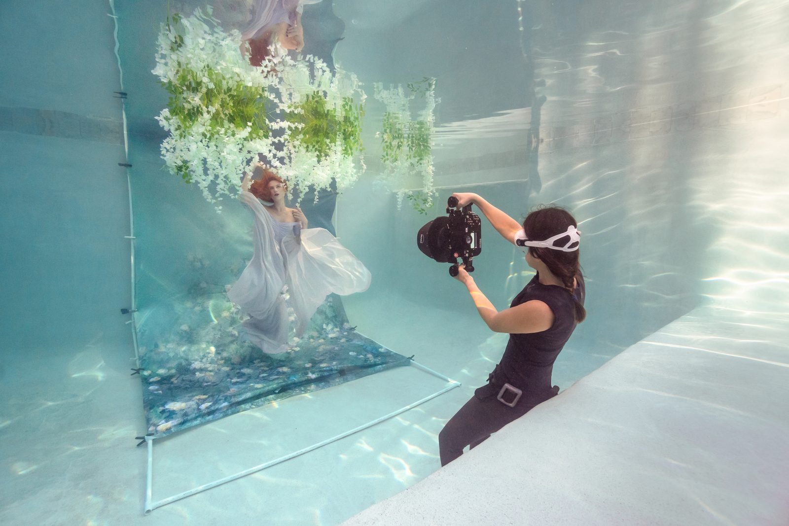 Kimber Greenwood photographing a model underwater