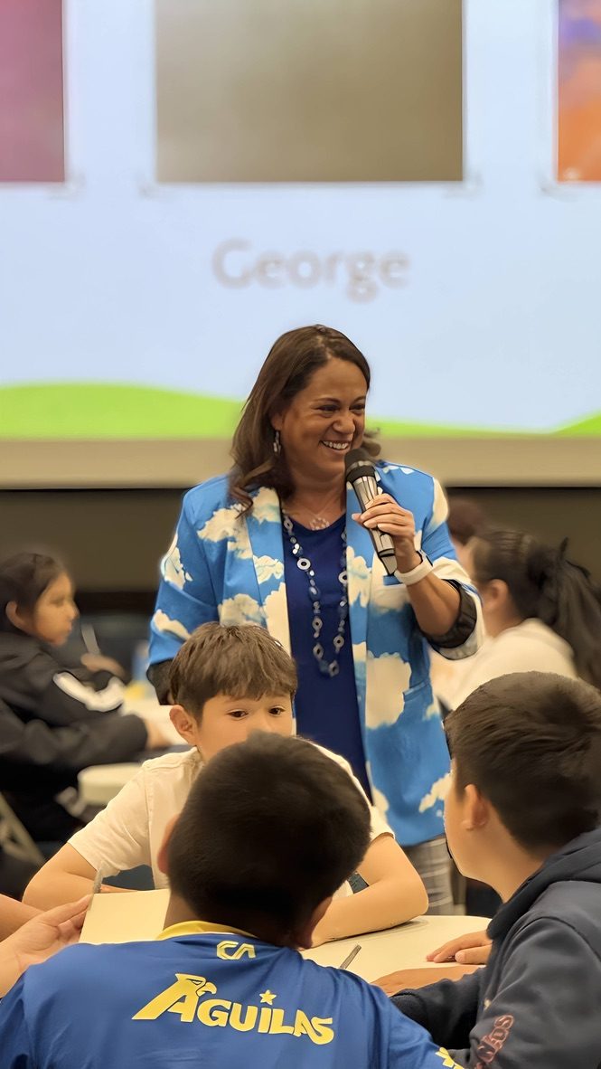 Lulu Buck speaking with students at an author visit