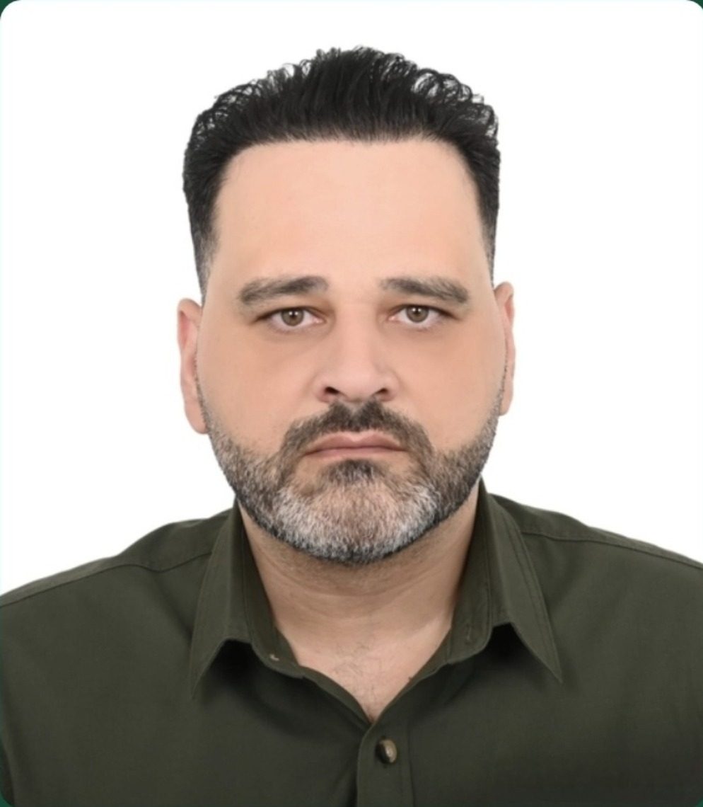 Ray Almir, CEO of Eagle Tec, in a dark green shirt against a white background