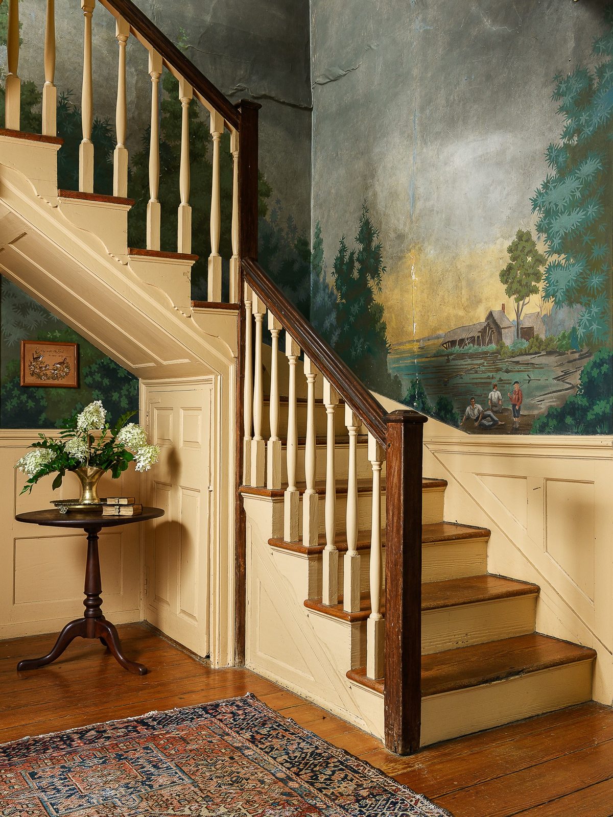 Staircase with painted mural photographed by Park and Vine Studio