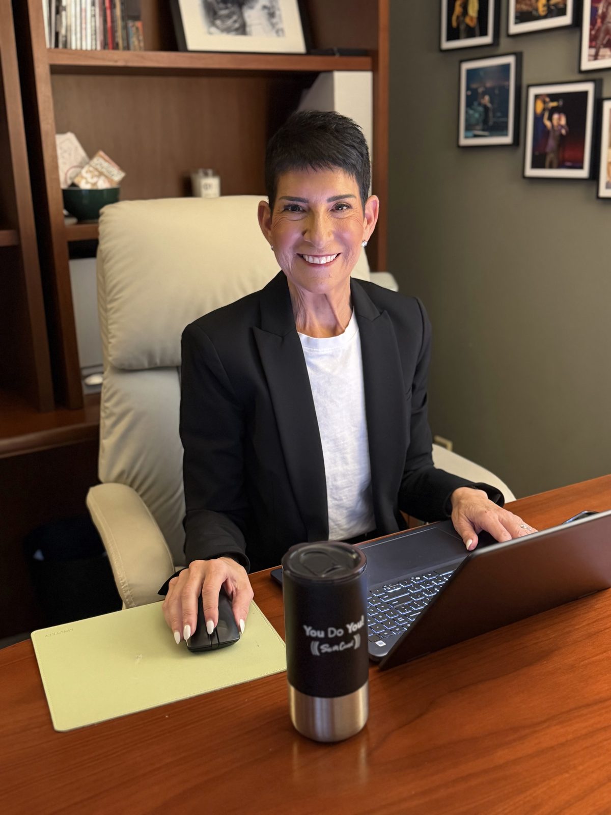 Sari Cicurel, founder of Sari M. Cicurel Public Relations, at her desk with a laptop in a black blazer