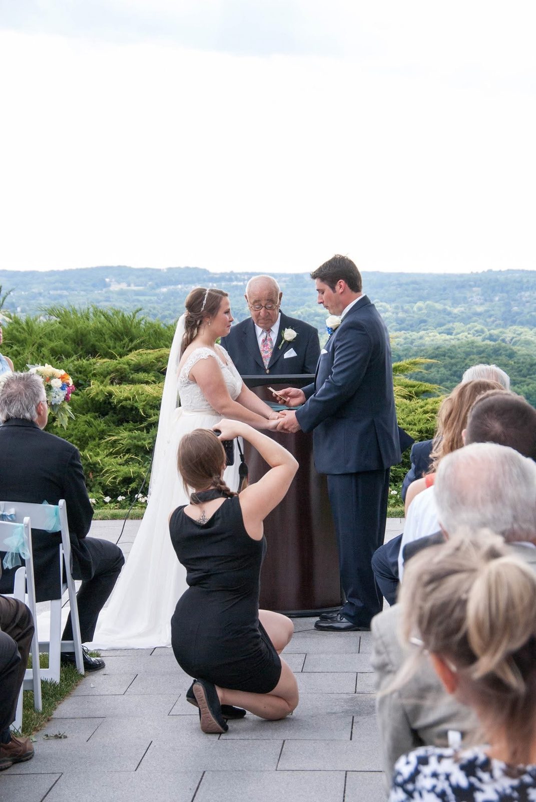 Theresa Covatto photographing a wedding ceremony