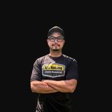 Andrew DePalma, founder of AJ's Hauling LLC, in a black AJ's Hauling T-shirt and cap with arms crossed
