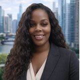 Carlene Herring, known as Ms. Radiance, owner and broker of record of Radiance Realty & Associates in New Jersey, smiling in a dark blazer with a city skyline behind her