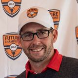 Chris Smeal, founder of Future Champions Golf, smiling in a white golf cap and sunglasses on a course
