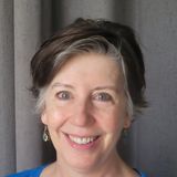 Rachel Tobler, licensed massage therapist and founder of Copper Mountain Manual Therapy in Herriman, Utah, smiling in a blue top
