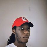 Robert Heard, founder of Sevens Magazine, in a red St. Louis Cardinals cap and a white T-shirt