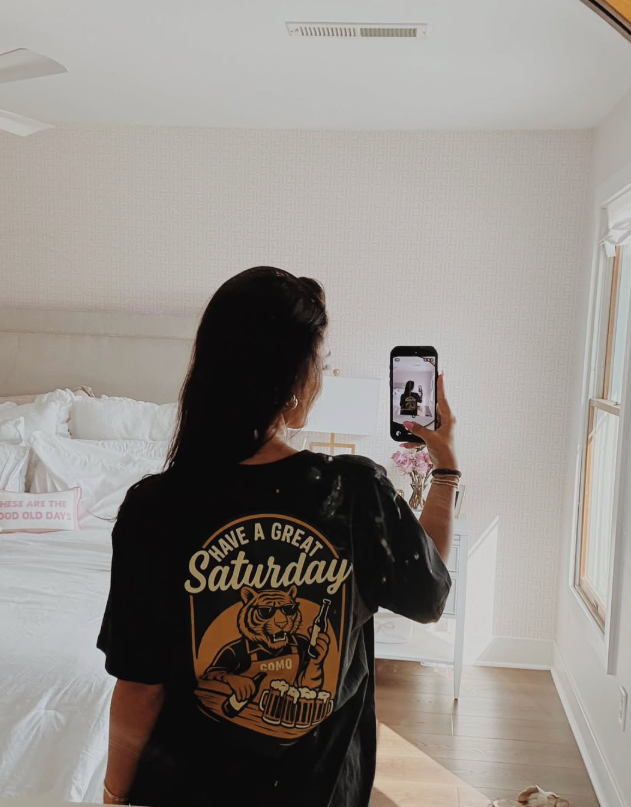 A customer in the HAGS Have a Great Saturday tee
