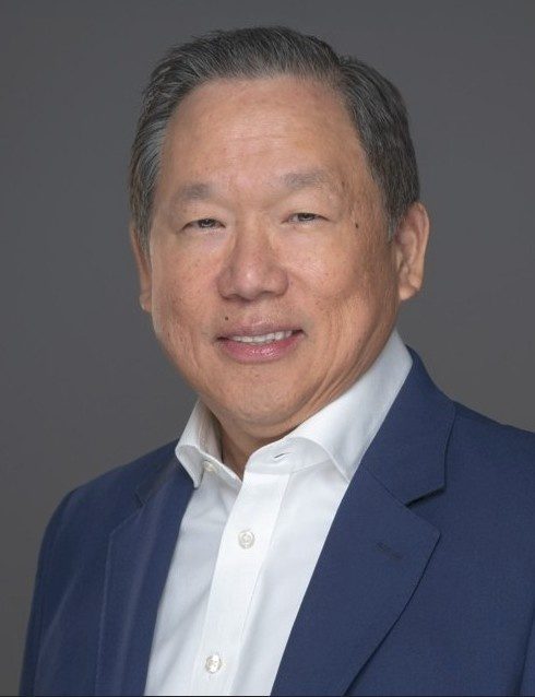 Will Lukang, founder of Kairos Elite Partnership, portrait in a blue blazer and white shirt